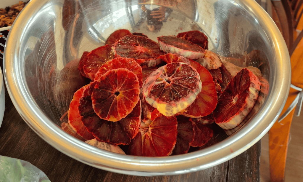 Slices of bright red citrus fruit in a bowl
