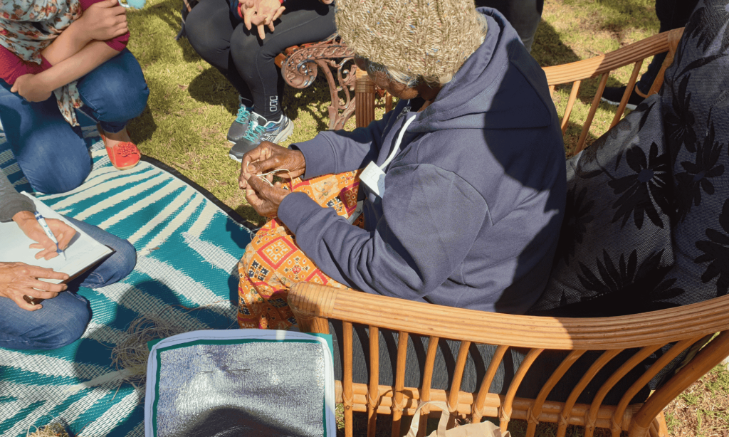 Tiwi Elder teaching how to weave
