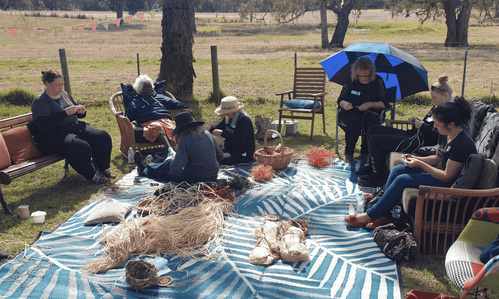Group of people weaving outside