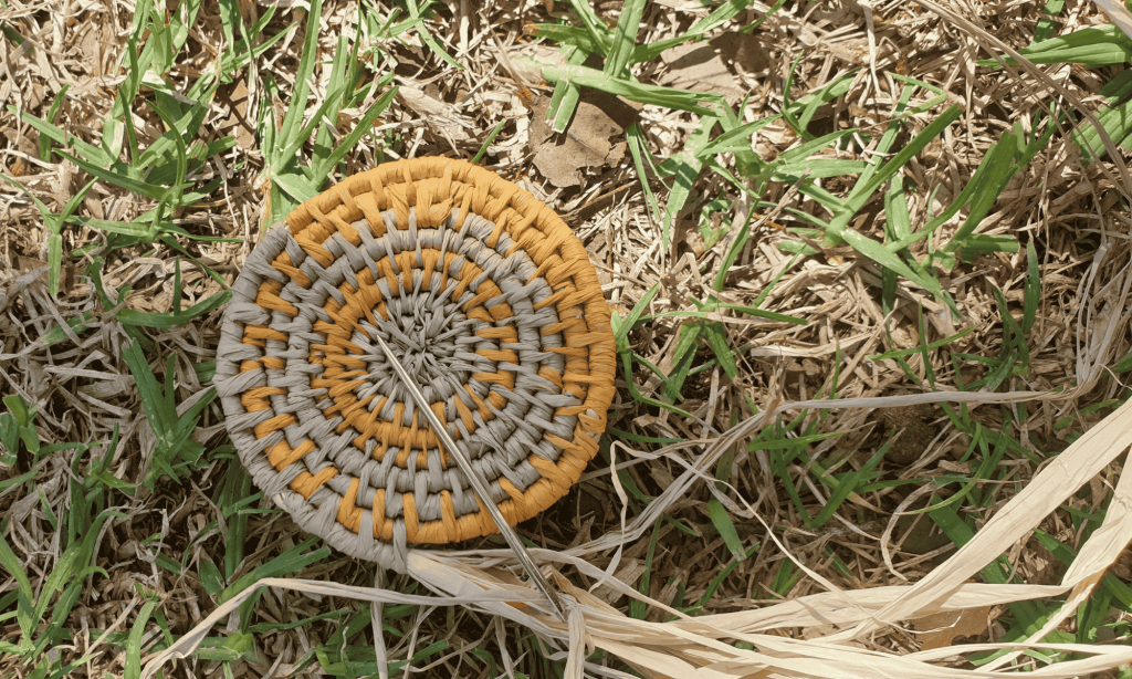 Close up of weaving design on grass